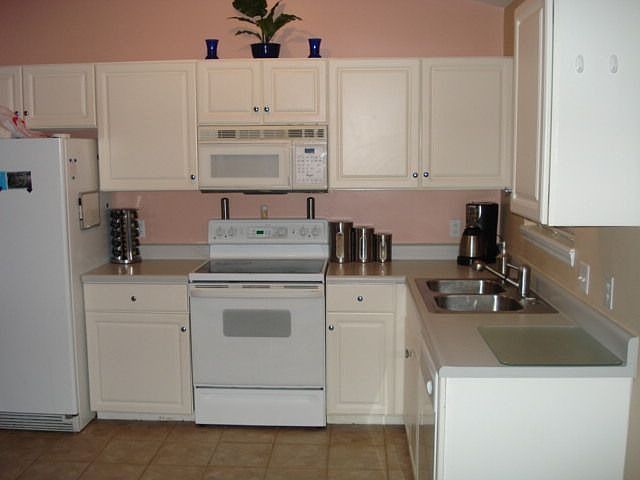 kitchen w/ yet again plant shelves.