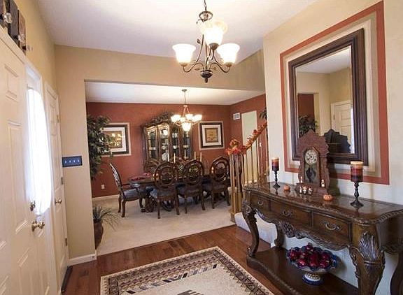 Warm & Inviting Entry Foyer welcomes you into this Gracious Residence.....