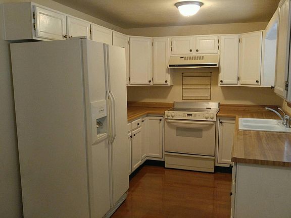 Kitchen with Side by Side Refrigerator, Flat top Stove and D
