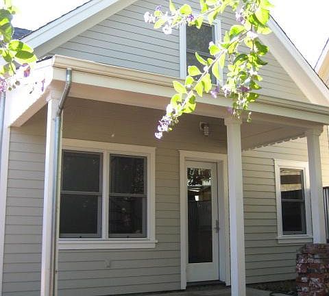 Rear entrance and private backyard.