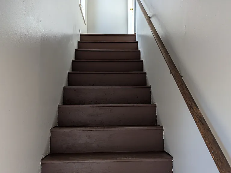 Stairs to the unit from the backyard.