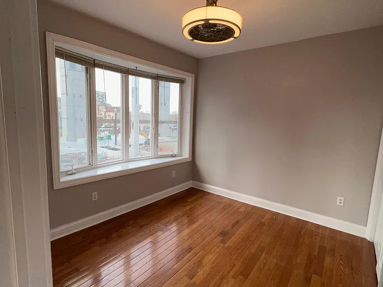 Large bedroom with bay window and large closet.