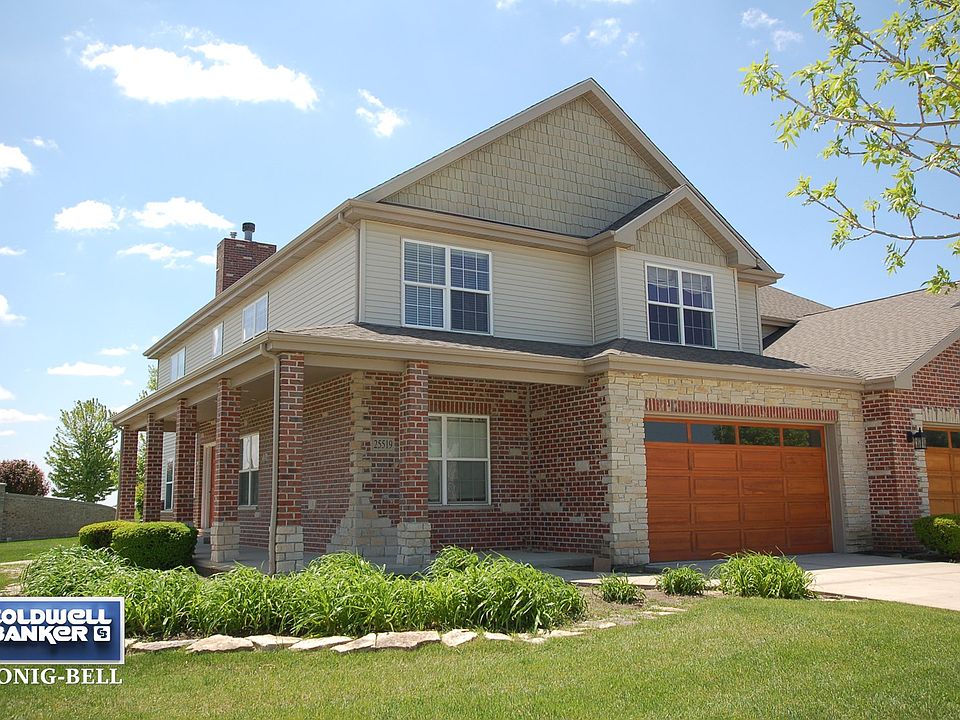 Two Story Townhome with Brick Exterior & Full Wrap Around Porch