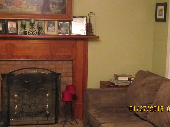 gas fireplace with beautiful mantle in living room