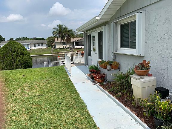 Side walkway to the stairs, dock and the water