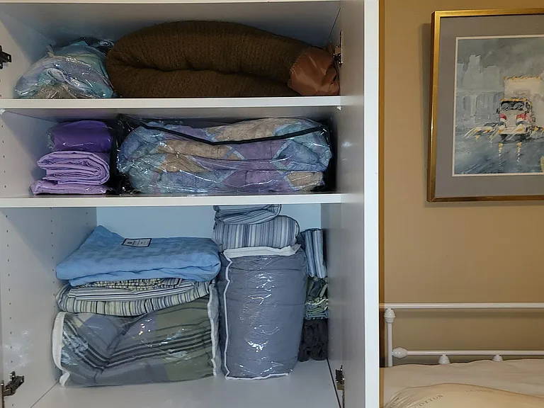 Many choices of linens here and towels,, washcloths in the bathroom.