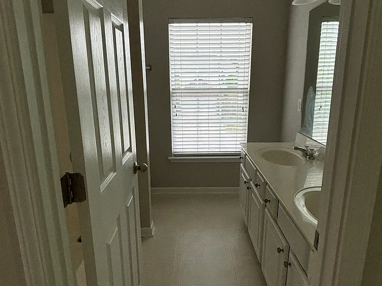 View of the bathroom as you pass the laundry room.