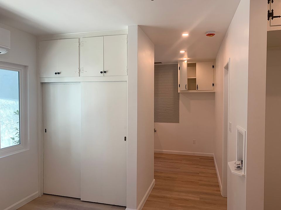 Studio looking at closet and kitchen hallway