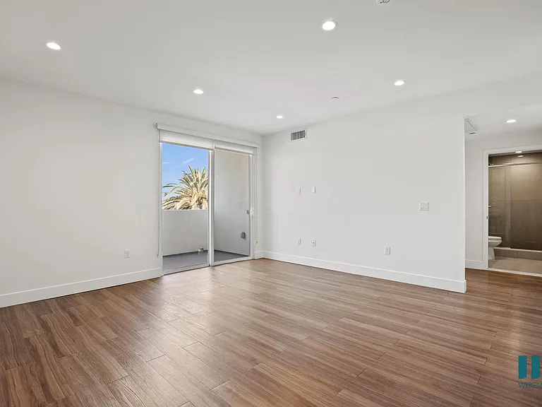 Living Room with Vinyl Flooring, Recessed Lighting, and Patio