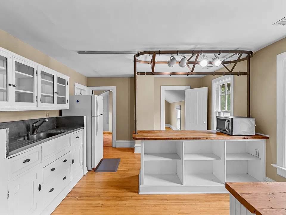 Kitchen with ample cabinetry, counter space, and convenient storage.