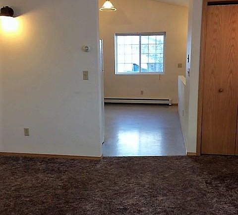 Main living & dining area with cathedral ceiling