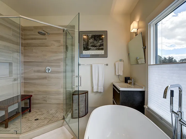 MASTER EN SUITE BATHROOM: SOAKING TUB, LARGE WALK IN SHOWER, DUAL SINKS AND STORAGE.
