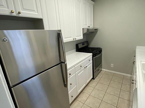Stainless Gas Stove & Fridge, Plenty Of Cabinets