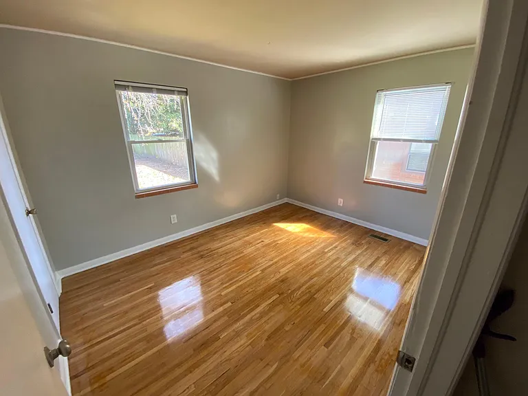 3rd bedroom with shades and closet