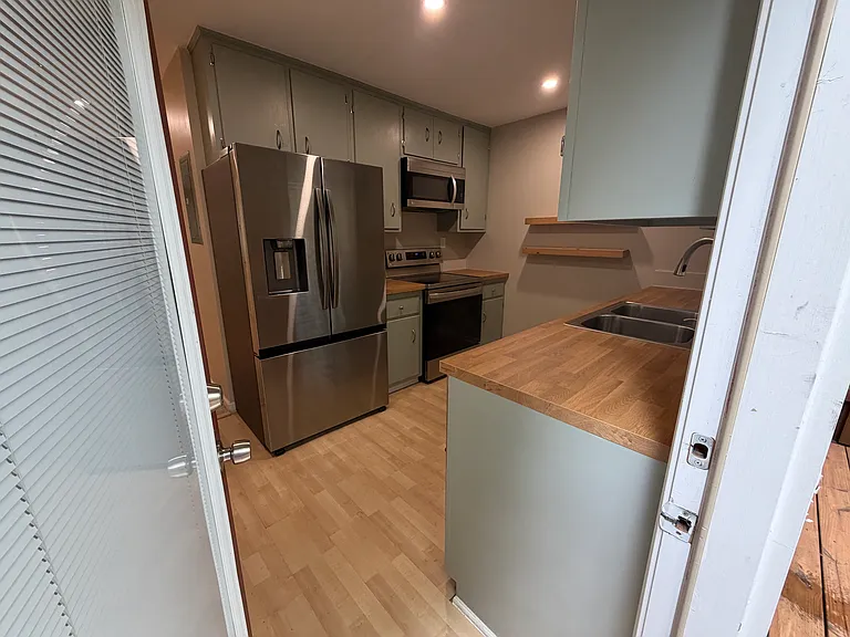 Kitchen with a door to the outside deck