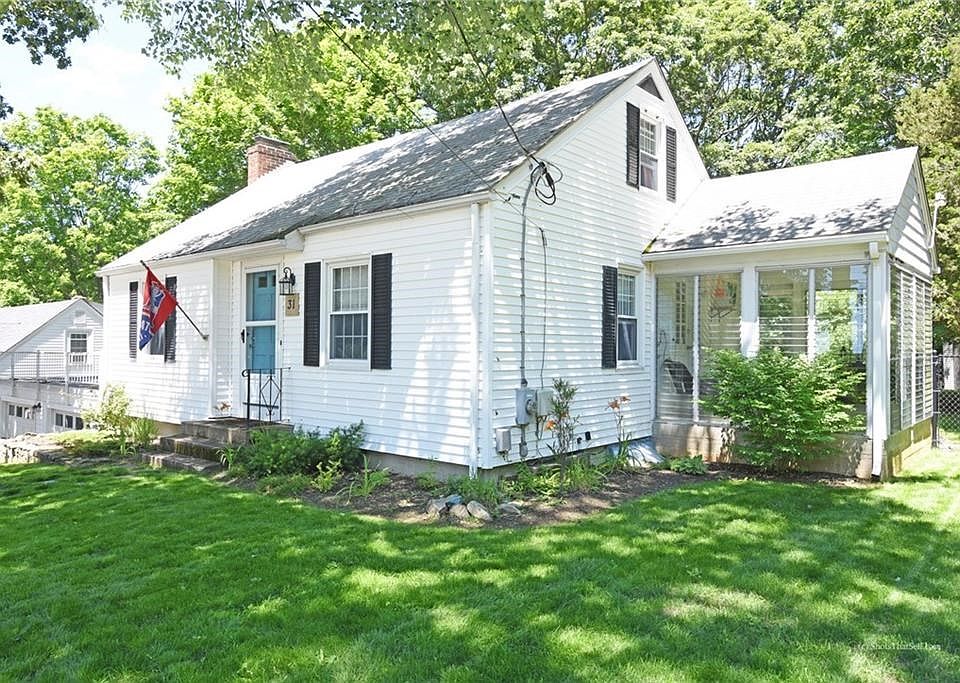 Front of house with view of sunroom
