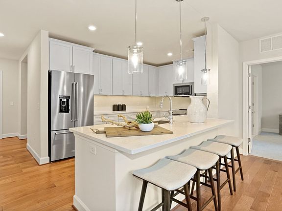 Kitchen with Peninsula Island Provides Ample Workspace and Storage