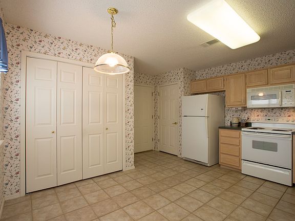 Blond cabinetry throughout home