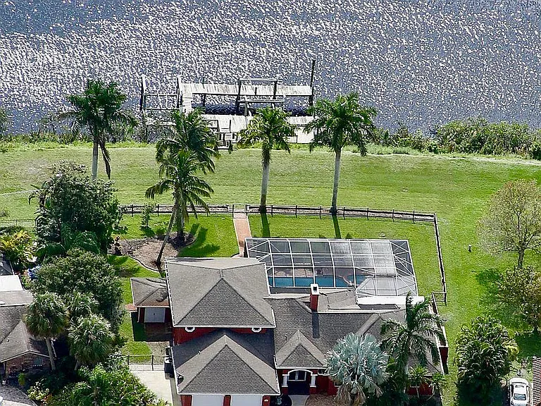 Situated on 1.5 lots, this beautiful waterfront property provides the features of a resort while maintaining the peace and privacy you're looking for.