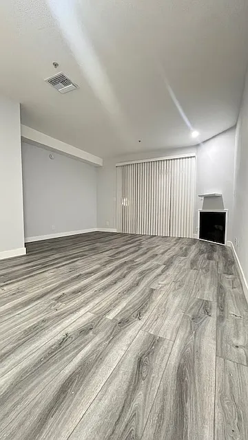 living room with a fireplace - Roscoe Townhomes