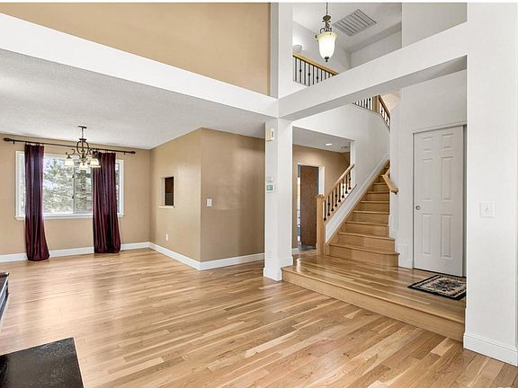 LIVING AND DINING ROOM WITH HIGH CEILINGS