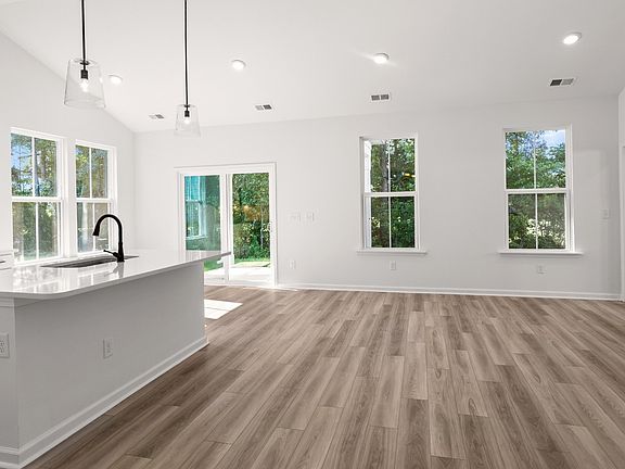 Spacious open-concept design with vaulted ceilings and bright natural light