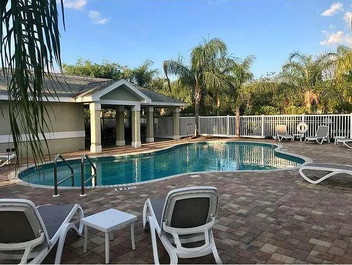 Community Pool with Two Tables under shelter & Two Bathrooms - 404 Harbor Ridge Dr