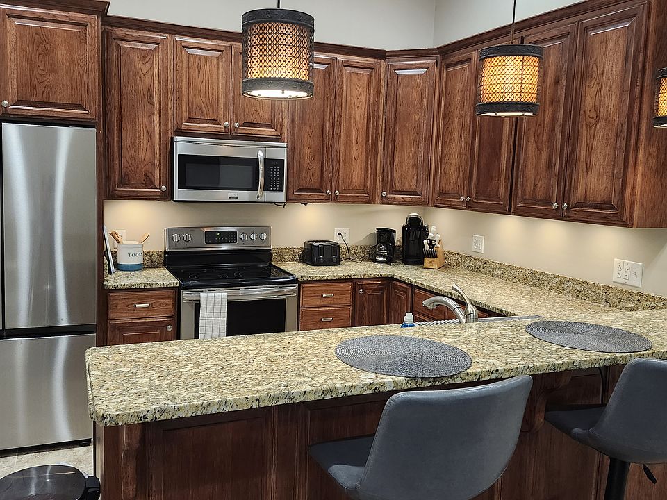 Kitchen with granite and artisan ice refrigerator