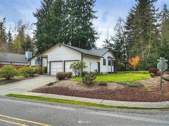 A large level corner lot is hard to find. Established landscaping makes a lovely setting. 