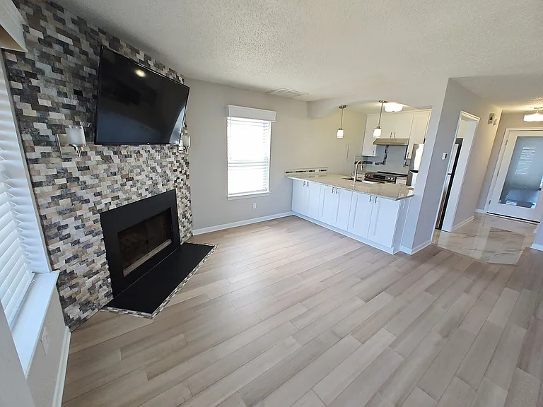 Wide angle view Living Rm, Kitchen & Entryway