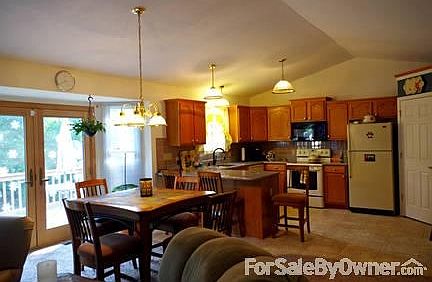 Dining Area and Kitchen
						:
						The Dining area over looks the back deck and woods. The kitchen has new granite.