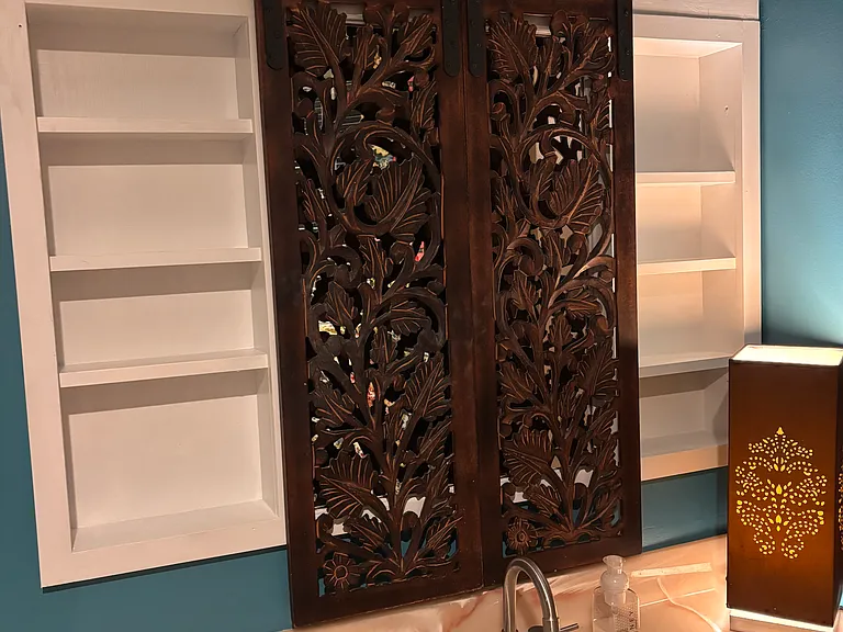 Cabinet doors on a slider to hide make-up, toiletries, etc.