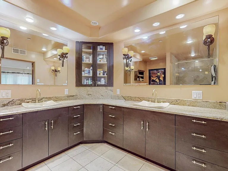 Master bathroom sinks and cabinets from the doors.