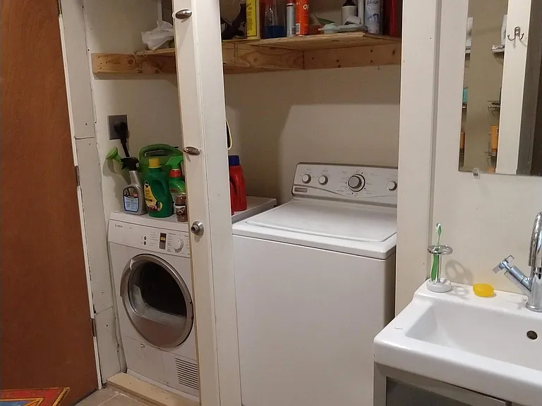 Laundry is tucked away in main floor bathroom.