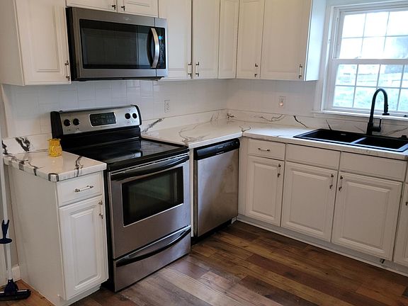 Another view of Kitchen - view of inside stove - dishwasher.
