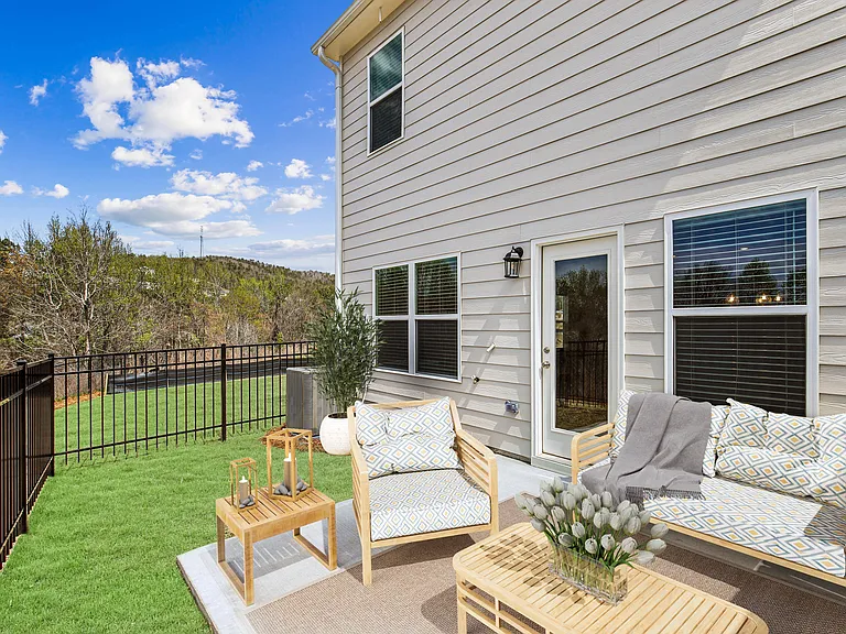 Back patio with fenced in yard.