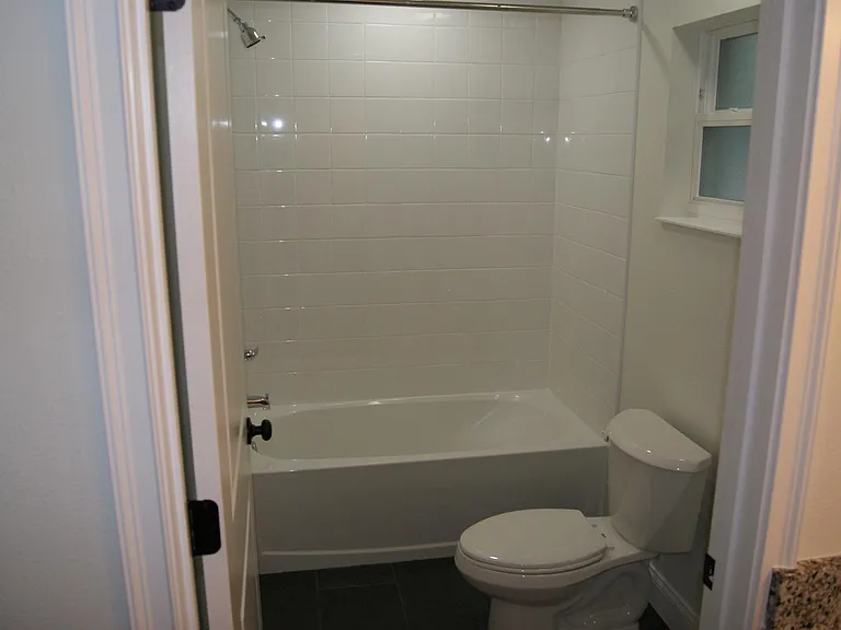 Private bathroom in primary bedroom with tub/shower