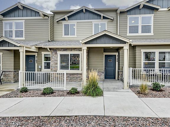 Front Porch. 2-Car Garage attached to rear of townhome.