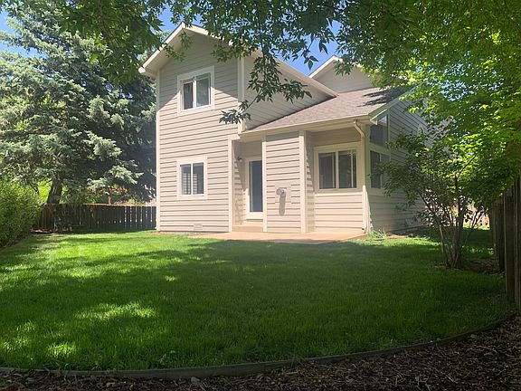 Back of house and back yard w/ patio
