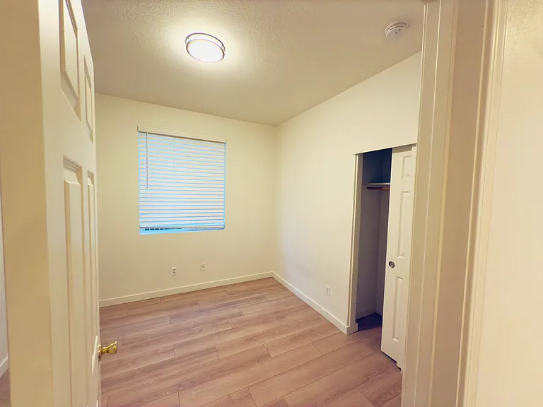 Room 2: A charming and intimate space, perfect as a cozy bedroom. Natural light enhances the room, making it a comfortable and inviting retreat.