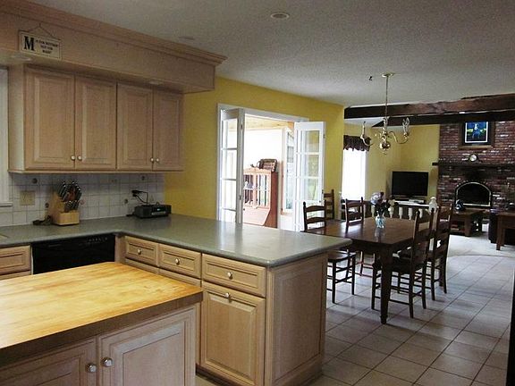 Open Kitchen and Family Room with
        Fireplace