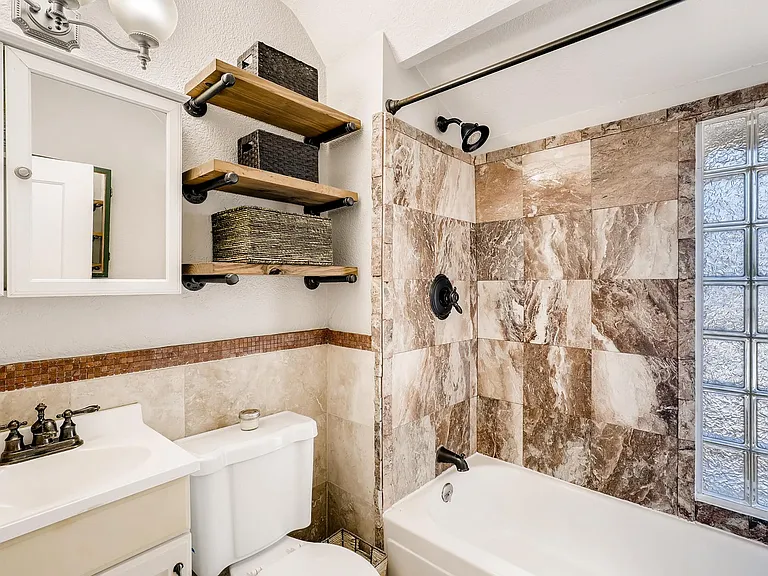 Upstairs bathroom w/ tiled shower