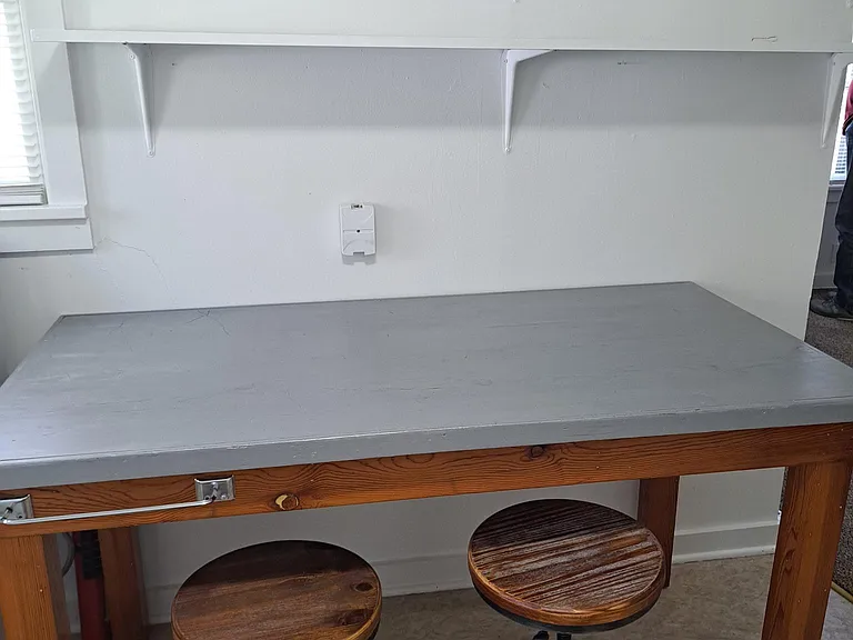 Eat in table for work area. Great shelving for more storage.