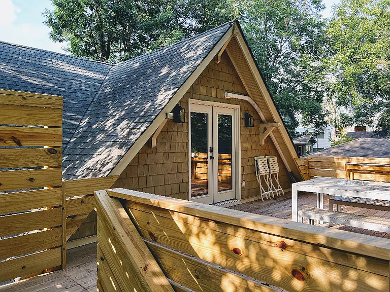 Double doors open to massive private deck