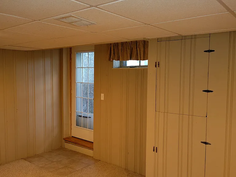 Back basement room, with door to back patio.