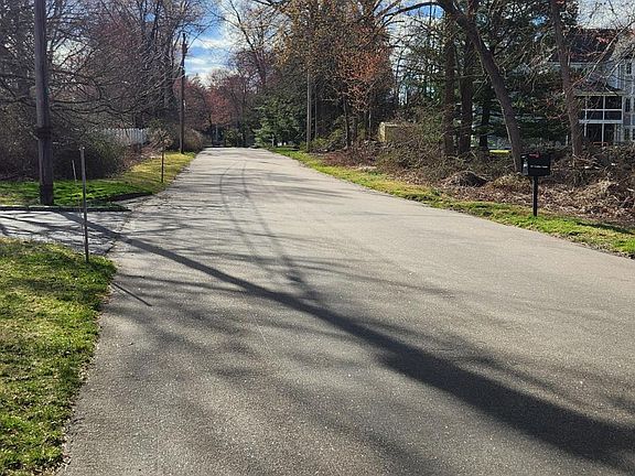 quiet street, across from land trust