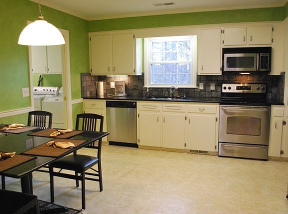 Kitchen has been updated with granite countertops, stainless steel appliances.