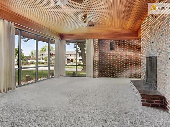 Showstopping Great Room With Huge Brick FP, Incredible Windows & Country Club View