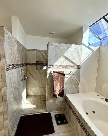 Light and bright Master bath with soaking tub and walk in shower