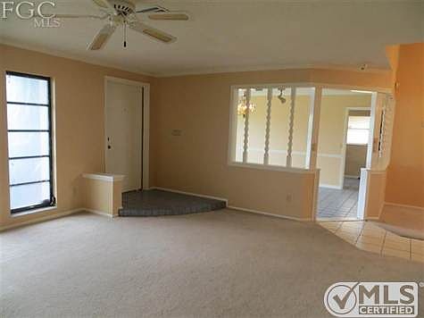 Entry door into formal living room.  Media room in background.